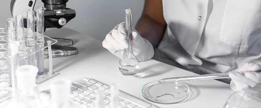 close-up-scientist-holding-glassware_23-2148794432